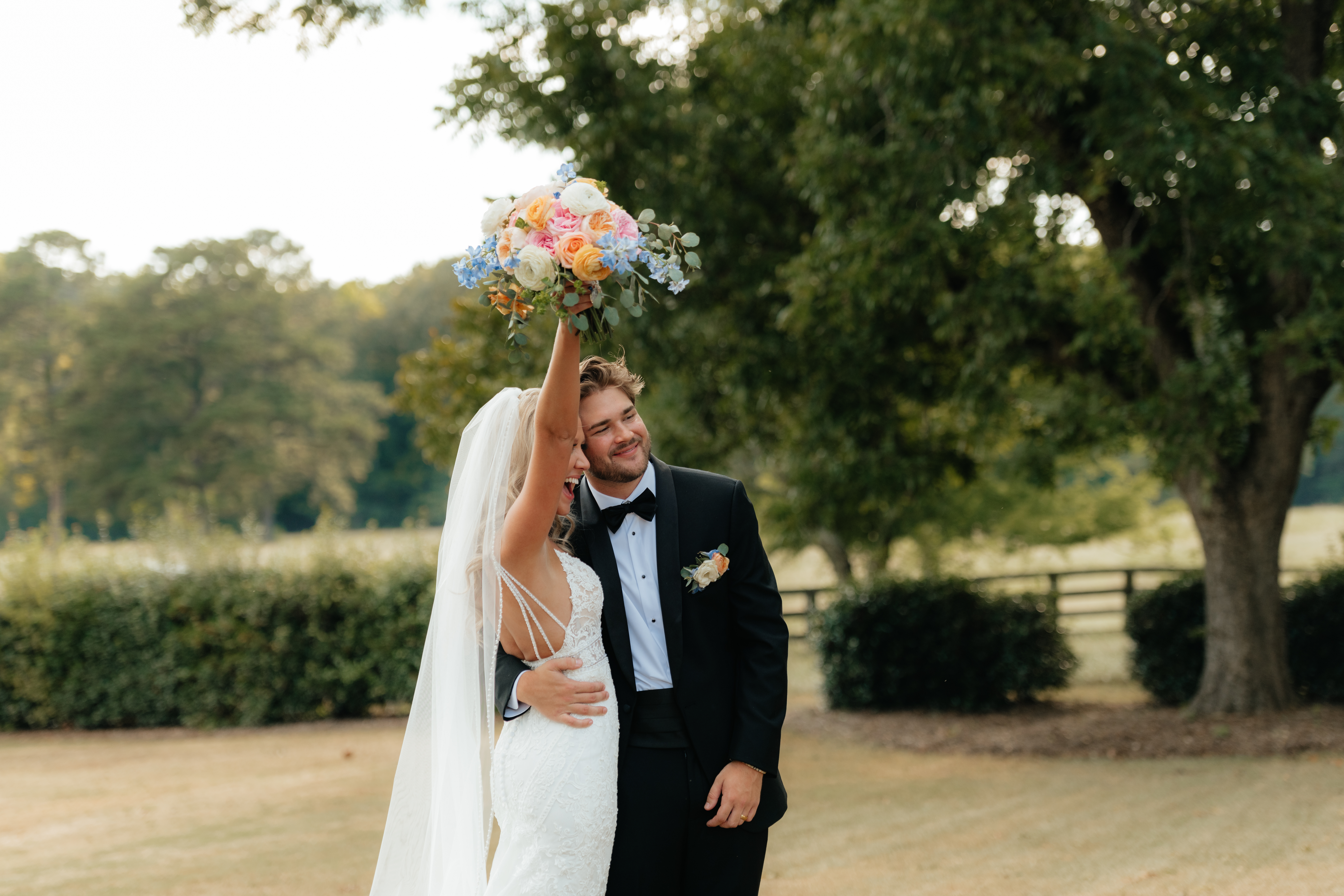 a bride and groom cheer together after their wedding ceremony at a venue near gadsden, alabama