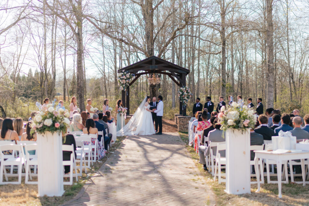 an outdoor wedding ceremony at seraphim grace wedding venue near gadsden, alabama
