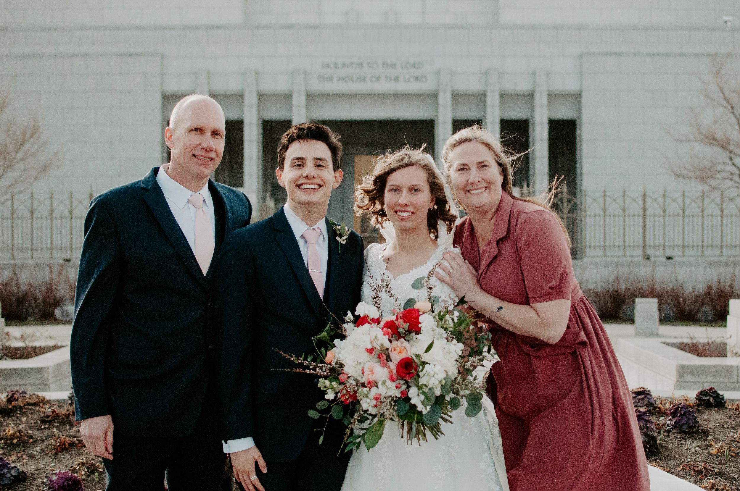 alabama and washington wedding photographer sarah mismash on her wedding day with her husband and parents, not wearing any makeup