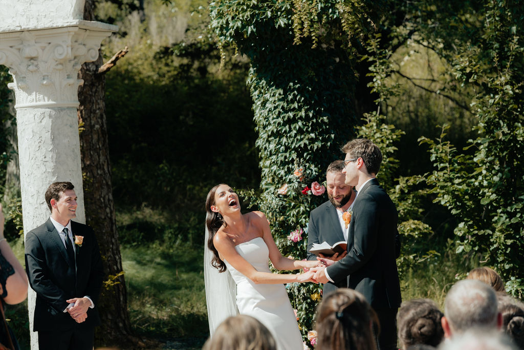 a bride laughs out loud during her wedding ceremony at howe farms in chattanooga tennessee