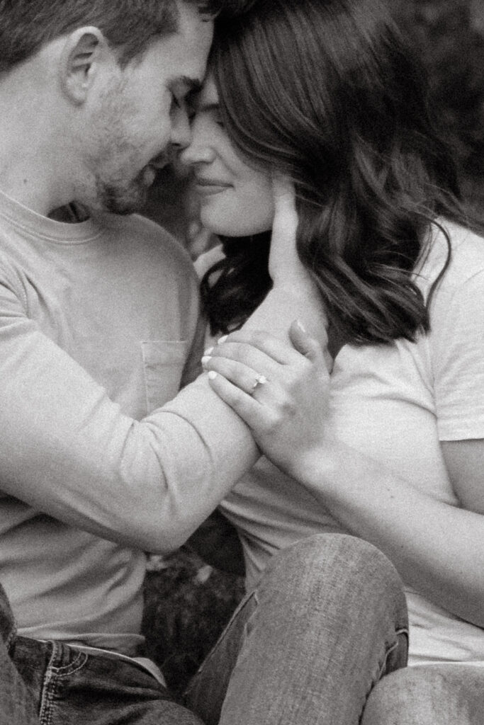a couple pauses in an intimate moment during their engagement photos in downtown huntsville with alabama wedding photographer Sarah Mismash