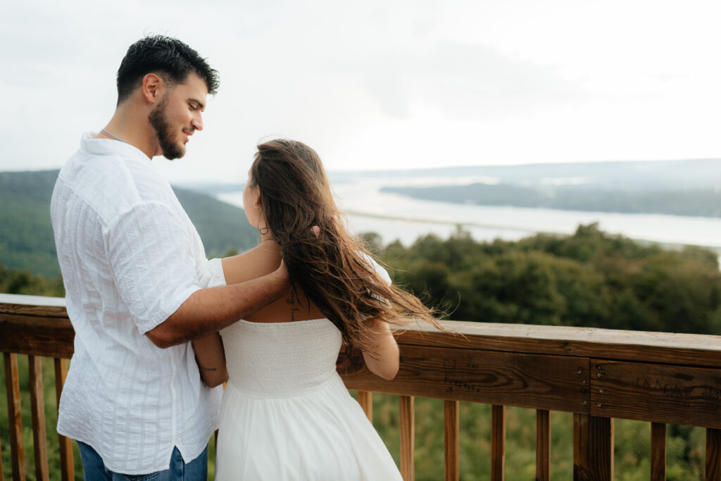 A couple lovingly look at each other at their Engagement Photos, Weathington Park, Guntersville, Alabama. Photos produced and edited by Alabama and Washington Wedding Photographer Sarah Mismash