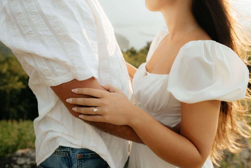 A couple embrace at their Engagement Photos, Weathington Park, Guntersville, Alabama. Photos produced and edited by Alabama and Washington Wedding Photographer Sarah Mismash