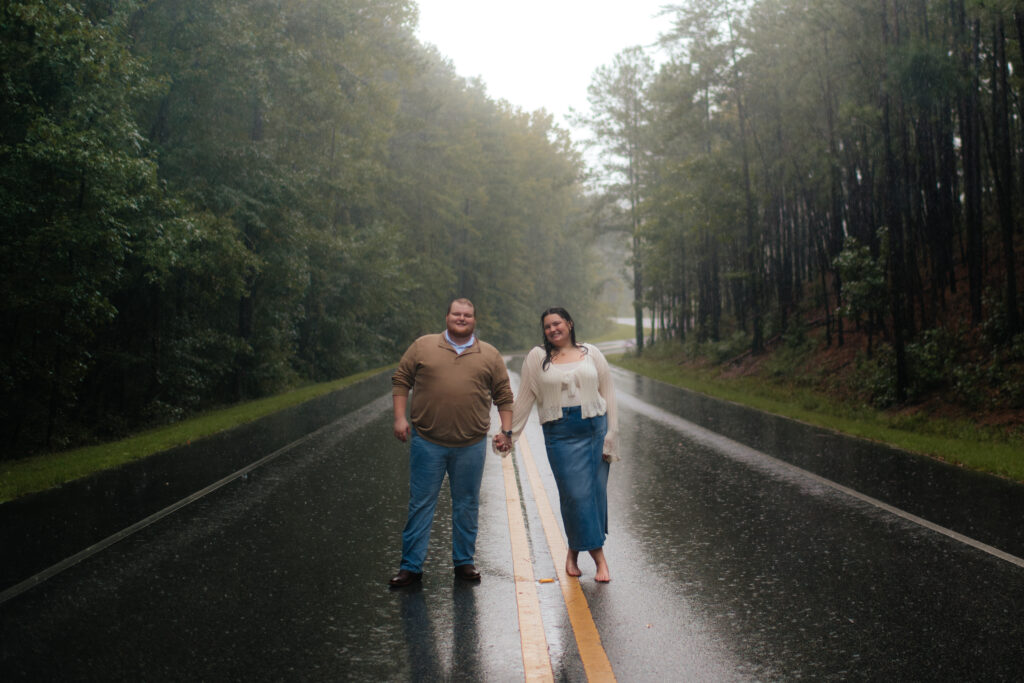 a couple in blue, cream, and brown outfits for their engagement photos stop during their sessions with washington and alabama engagement photographer sarah mismash