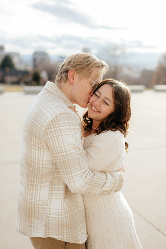 a couple hugs during their engagement photos at the state capital with olympia engagement photographer sarah mismash