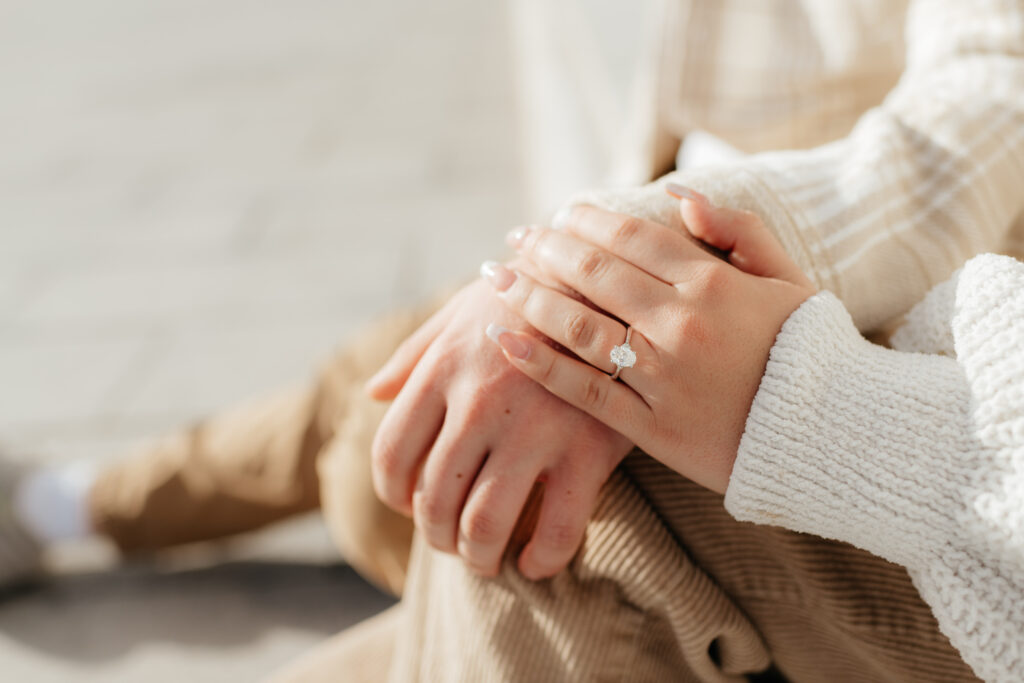 a close up of a brides engagement ring during her engagement photos at the state capital with olympia engagement photographer sarah mismash