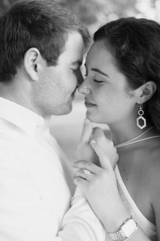 an intimate portrait of a couple during a quiet moment of their engagement photos at Guntersville Lake with alabama wedding photographer Sarah Mismash