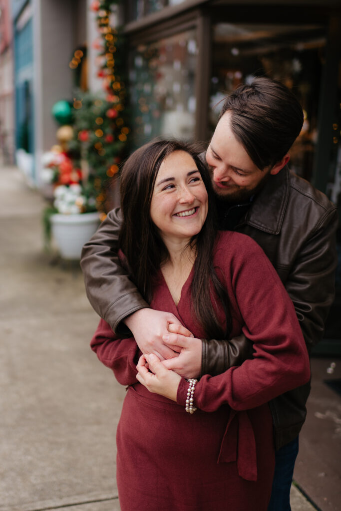 a couple wears a red and brown outfit during their engagement photos with alabama and seattle engagement photographer sarah mismash