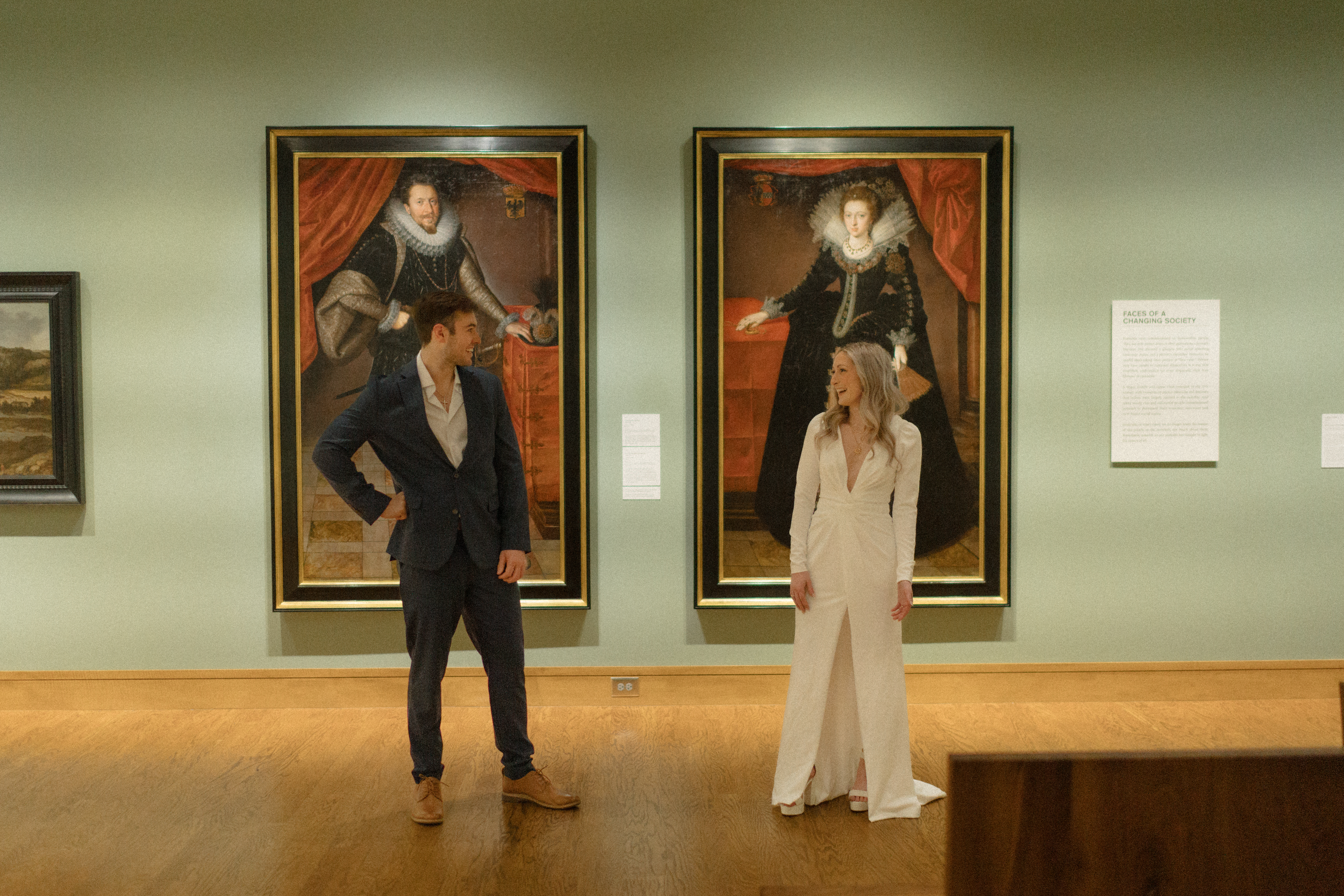 a couple mimics the art together during their engagement photos at the Seattle Art Museum with seattle engagement photographer Sarah Mismash