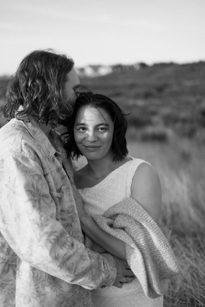 a bride smiles at engagement photographer sarah mismash during her washington coast engagement photos