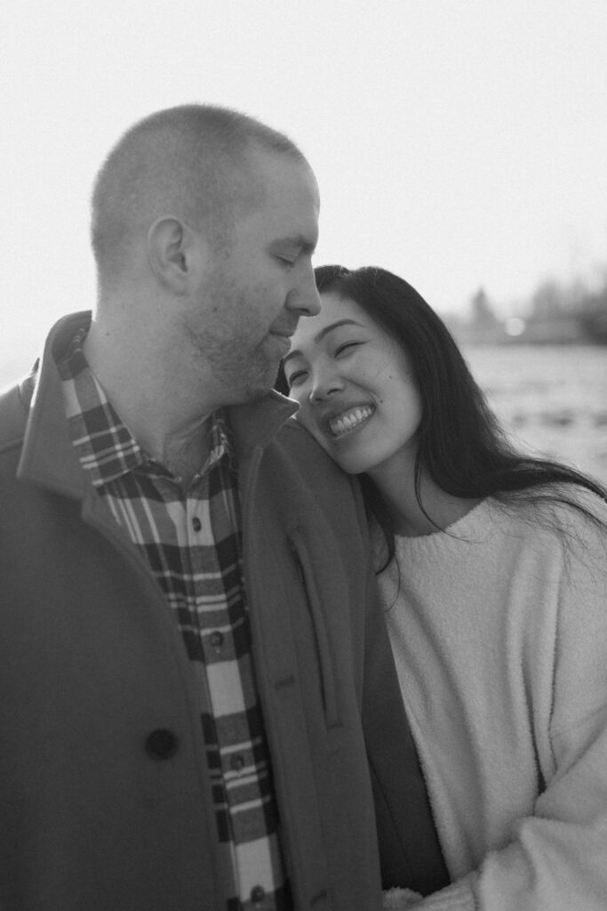 a couple hugs during their engagement session with north bend engagement photographer Sarah mismash