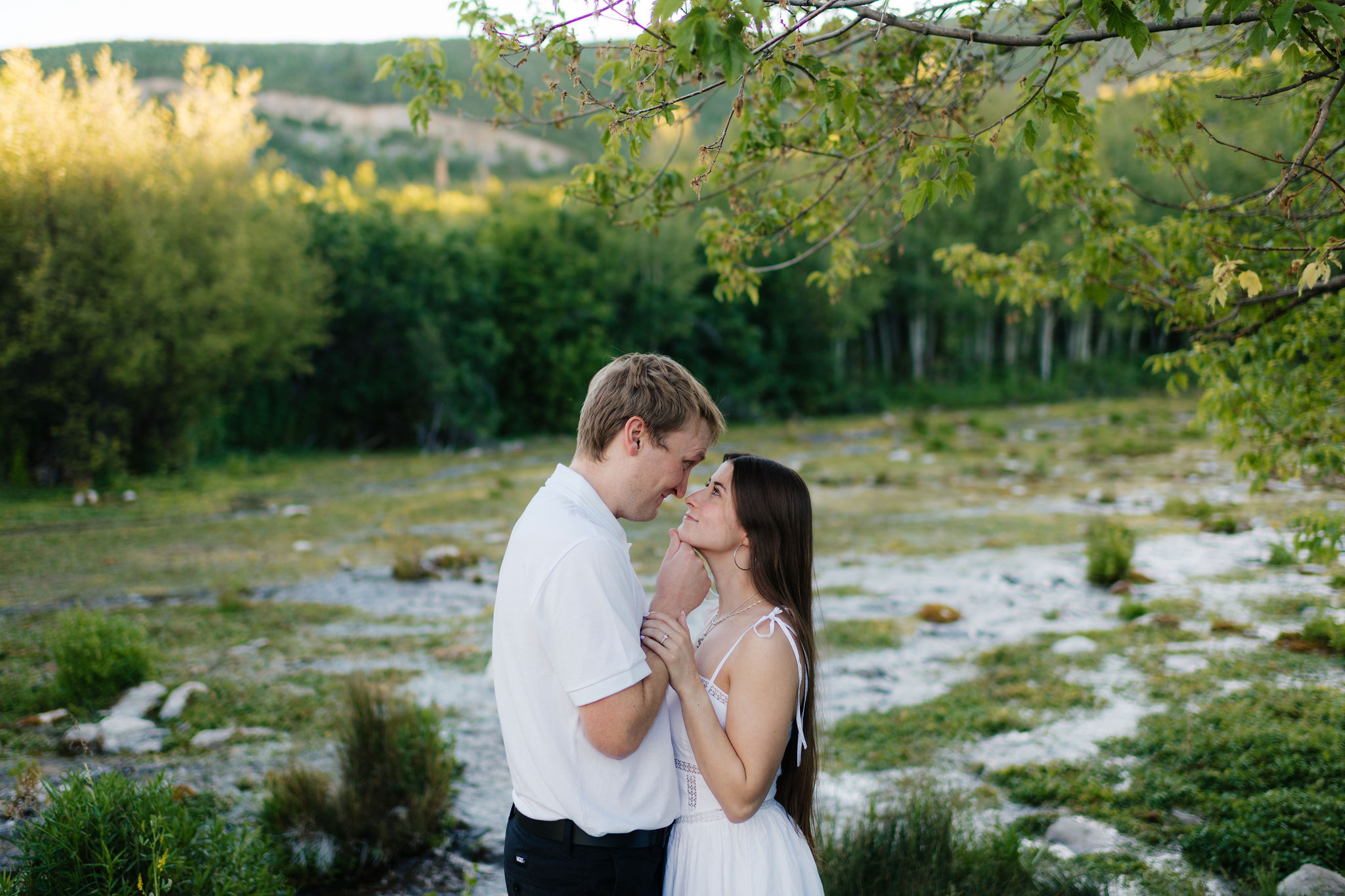 a couple during their summer engagment photos in the alpine loop at american fork canyon and provo canyon, photographed by utah county engagement photographer sarah mismash