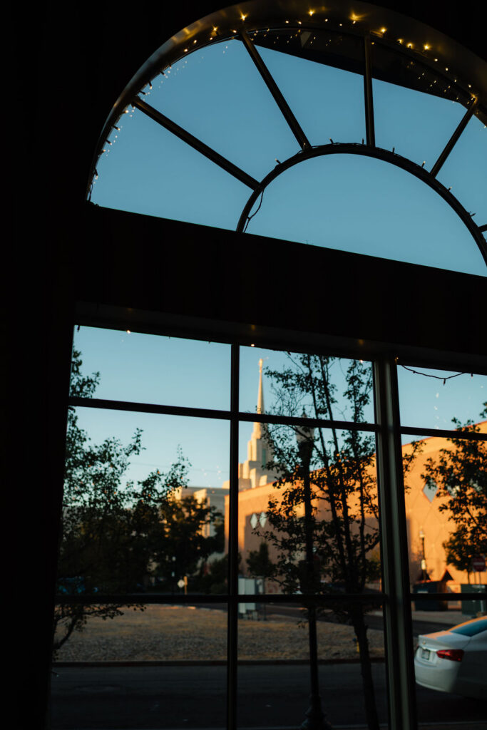 view of the ogden temple from the window of the grand view during an august wedding photgraphed at the grand view wedding venue in ogden, utah by utah wedding photographer sarah mismash