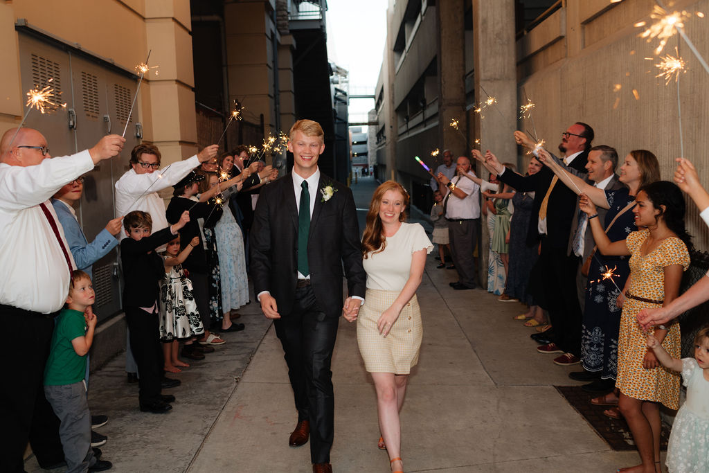 wedding exit with sparklers during an august wedding photgraphed at the grand view wedding venue in ogden, utah by utah wedding photographer sarah mismash