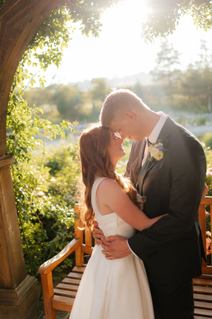 a couple under the gazebo of ashton gardens at thanksgiving point