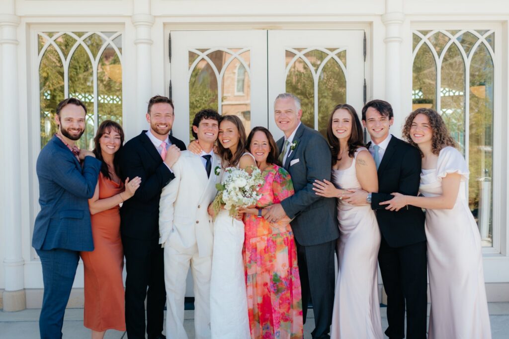 family photo at the provo city center temple after a september afternoon sealing, photographed by provo city center temple wedding photographer sarah mismash