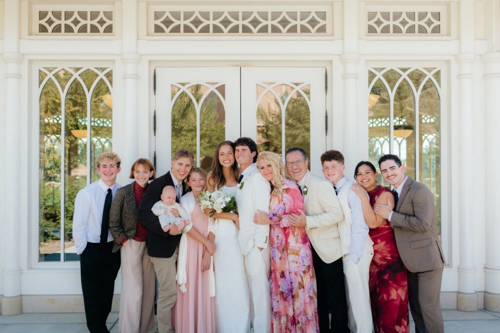 family photo at the provo city center temple after a september afternoon sealing, photographed by provo city center temple wedding photographer sarah mismash