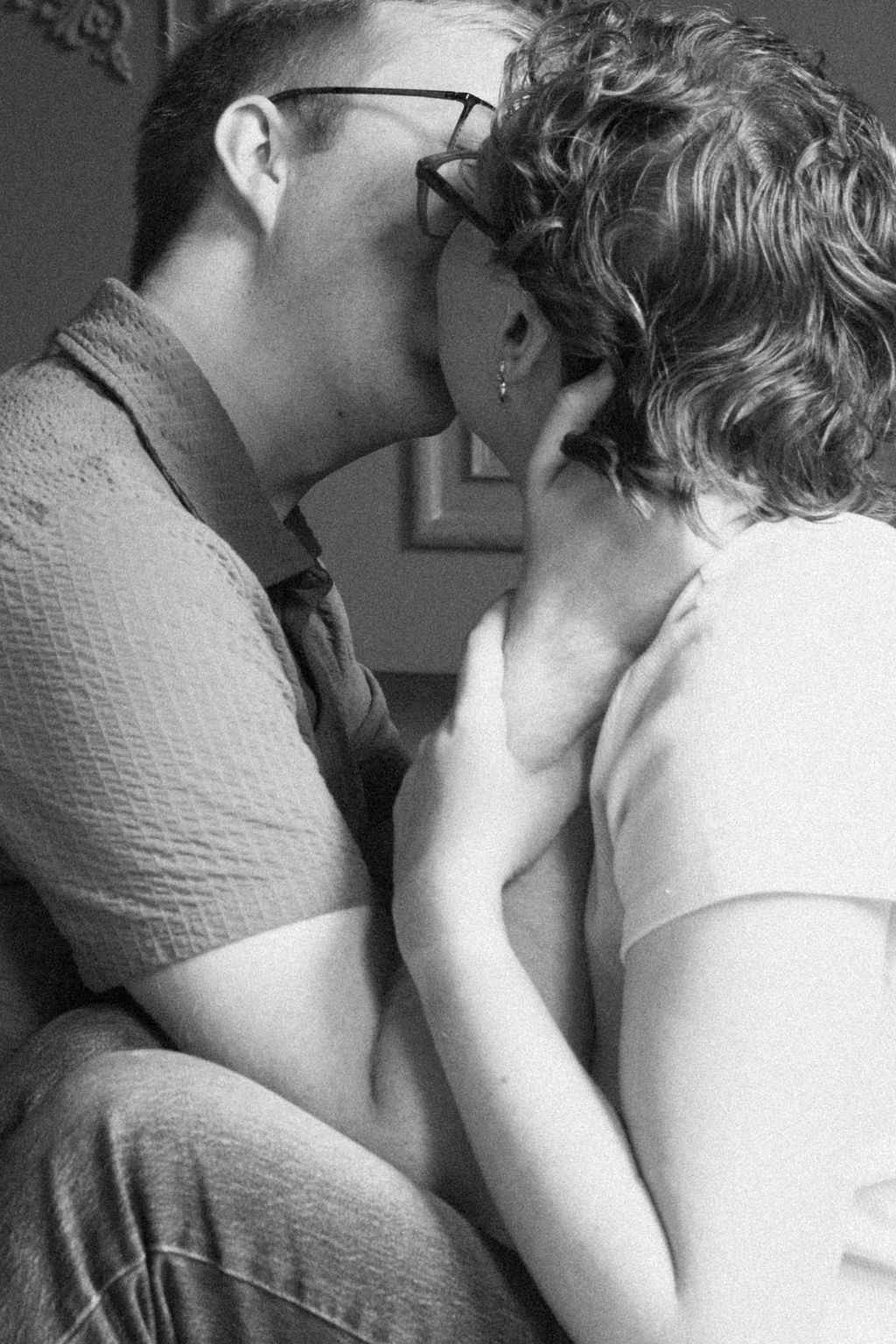 a couple kisses in the conservatory of the brightwood house studio in provo utah
