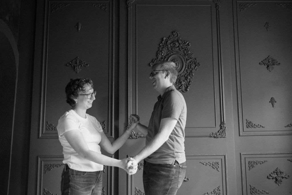 couple dancing during their indoor engagement photos at brightwood house studios in provo utah